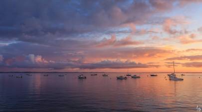 Photo de Arcachon - Lever de soleil sur les bateaux aux corps morts